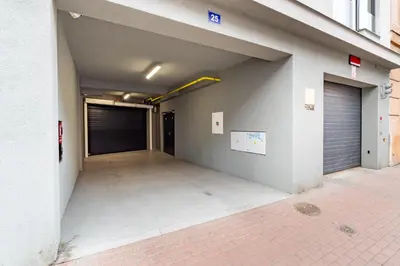 an empty parking garage with a garage door at Brand new studio apartment # 42 in brand new building with free parking in the center in Prague