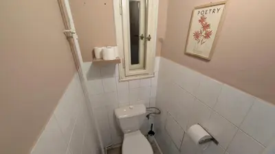 a small bathroom with a toilet and a mirror at Flat in Prague -503- in Prague