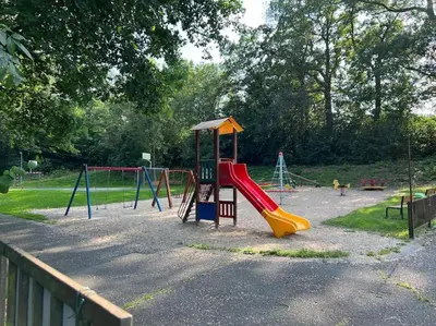 a playground with a slide in a park at Byt apartman 73m2 Klid příroda Parking FREE in Prague