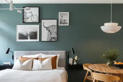 a bedroom with a bed and a table with candles at TurnKey I Republic Square Apartments in Prague