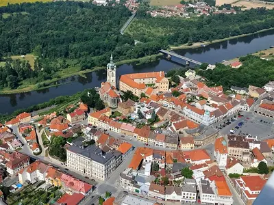 an aerial view of a town next to a river at Dům V Podzámčí in Mělník