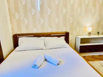two towels on a bed in a bedroom at aparthotel in Prague Centre in Prague