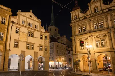 a city street at night with buildings and a street light at Adam's Apartment - Best Location in Prague