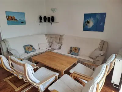 a living room with a table and a couch at Wellness Villa Vranov 55 in Čerčany