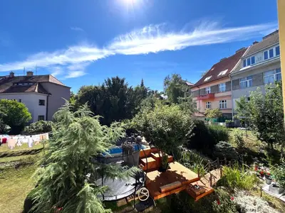 a view of a yard with trees and buildings at Apartmán l Praha centrum in Prague