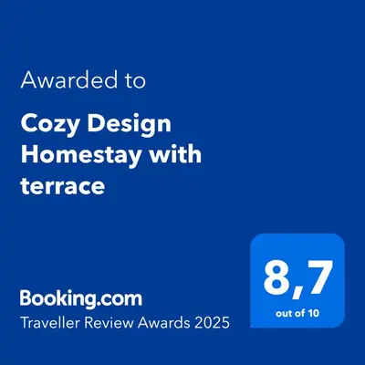 a blue screen with the text upgraded to cozy design homepage with fireplace at Cozy Design Homestay with terrace in Prague