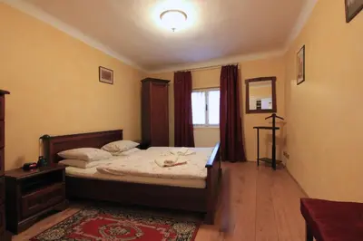a bedroom with a bed and a window at Prokopska in the heart of Mala Strana in Prague