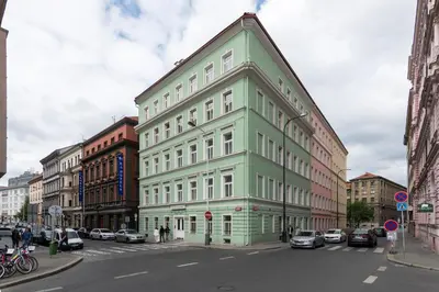 a bathroom with a toilet and a sink and a shower at City Haven Apartments in Prague