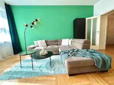 a living room with a couch and a table at Luxury Apartment in Old Town in Prague