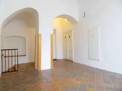 an empty room with white walls and a tile floor at Apartment Old Town home-5 by Interhome in Prague