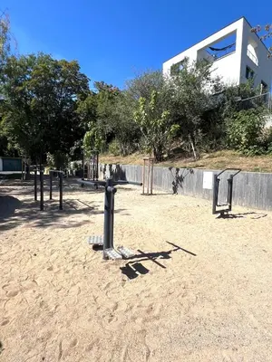 a park with a bunch of playground equipment in the sand at Apartmán II centrum Praha in Prague