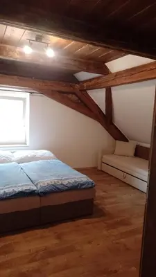 a bedroom with a bed and a window at Ubytování Ždírec - Apartmán 2 in Ždírec