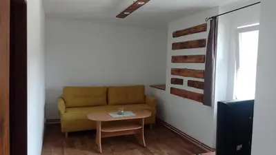 a living room with a couch and a table at Ubytování Ždírec in Ždírec