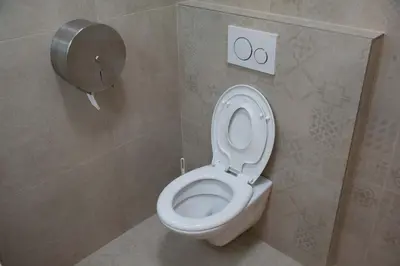 a bathroom with a white toilet in a stall at New City Centre Garden Apartment - Central Location in Prague