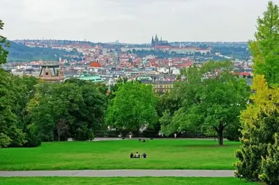 a group of people in a park with a city in the background at Artisan & Old-timey 2 bedrooms home in Prague