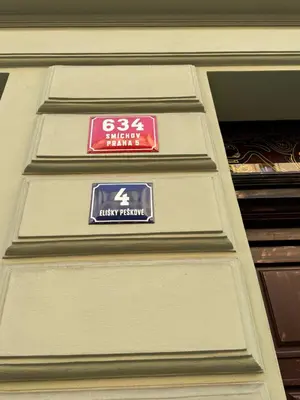 a sign on the side of a building at Arbes 10 - At the yellow Duck in Prague