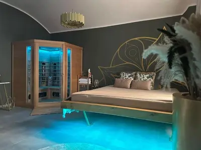 a bedroom with a large bed with pillows on it at Offspa privátní wellness in Prague