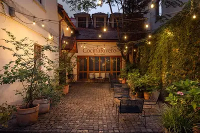 a building with a patio with plants and lights at Delightful Old Town Studio in Prague