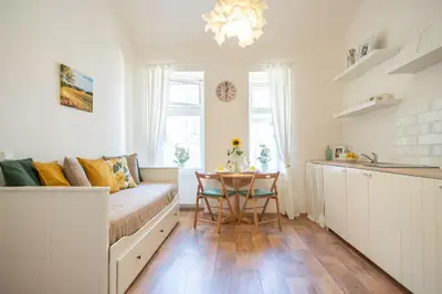 a living room with a couch and a table at Nice one bedroom apartment in zizkov in Prague