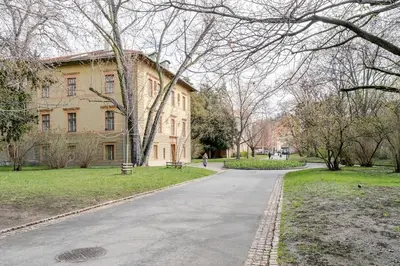 an empty road in front of a building at Blueground Vršovice private terrace equipped PRG-8 in Prague