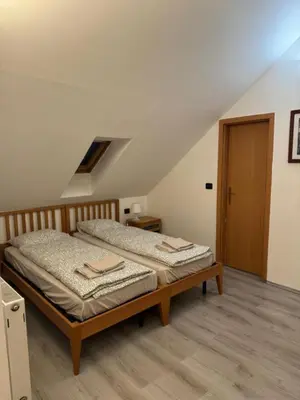 a bedroom with two beds in a attic at Cool Duplex with terrace near Florenc in Prague
