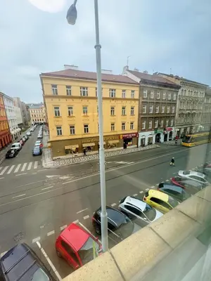 a view of a street with cars parked in a parking lot at Cozy Nest Home in Prague