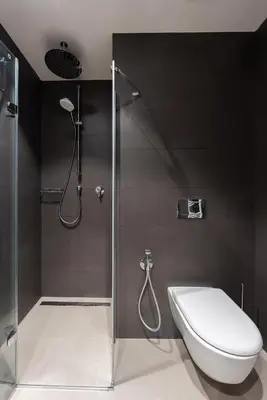 a bathroom with a shower with a toilet and a sink at Fresh All-in Apartment Prague in Prague
