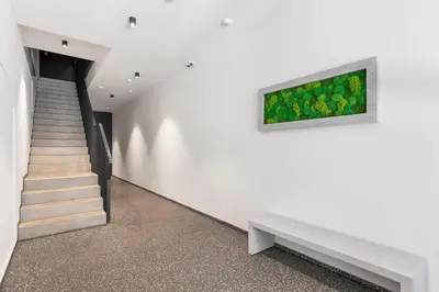 a staircase in a house with a painting on the wall at REAL Living by REFA Karlin 305 in Prague
