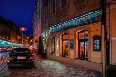 a car parked in front of a building at night at 1 Bed Flat - Sleeps 3 - Pets - Wifi in Prague