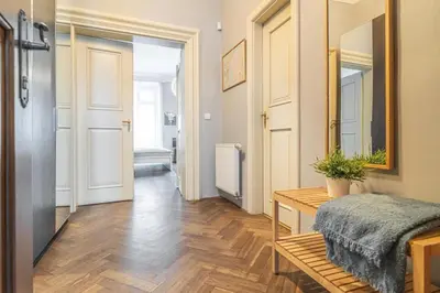 a room with a hallway with a table and a mirror at 1 Bed Flat - Sleeps 3 - Pets - Wifi in Prague