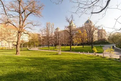 a park in front of a large building at Stylish 2BR with stunning view of National Muzeum in Prague