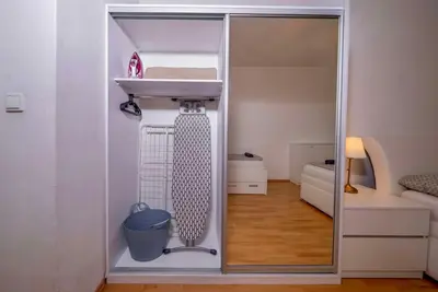 a small room with a sink and a room with a bedroom at 4 Bob's Apartments - 3 bedrooms, King size beds in Prague