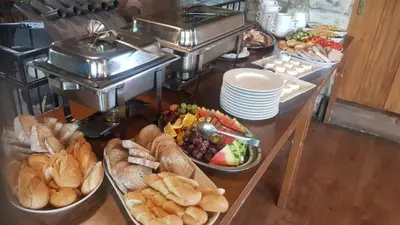 a buffet with different types of bread and other food at Kemp v areálu pivovaru Malý Janek z Jinec in Příbram