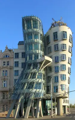 a building with a sculpture in front of it at Soukromý pokoj B4 káva v ceně in Prague