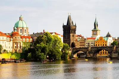 a city with a river and a bridge and buildings at Single room B5 centre of Prague in Prague