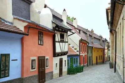 an alley with colorful houses on a street at Nice room E3 Prague 7 in Prague
