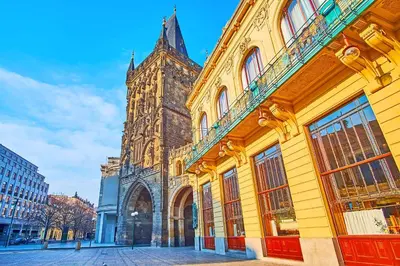 a large building with a tower in a city at Prague room Letná H2 in Prague