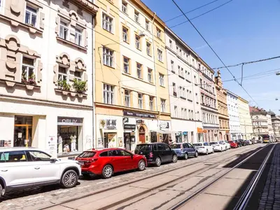 a row of cars parked on a city street at Angel room with large terrace R6 in Prague