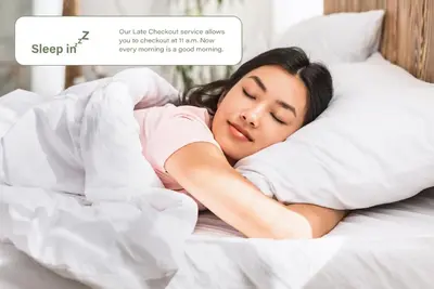 a woman sleeping on a bed with a pillow at HOMELY I Central 44m2 APT I ELEVATOR I Self Check-In in Prague