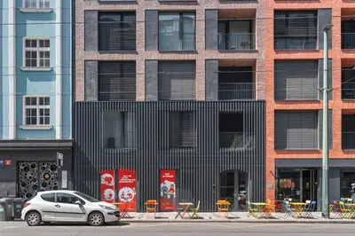 a silver car parked in front of a building at REAL Living by REFA Karlin 408 in Prague