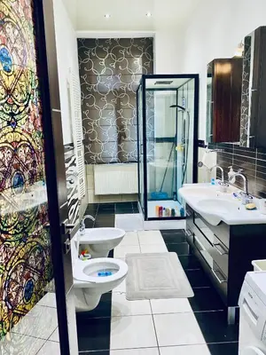 a bathroom with a toilet and a sink at Prague service Apartment - Central square location in Prague