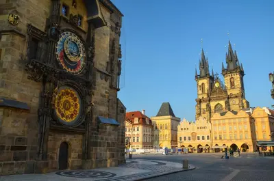 a building with a clock on the side of it at Soukromý pokoj Milada in Prague