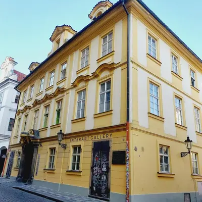 a yellow building on the side of a street at Just 3 min Walk Old Town Center private room E in Prague