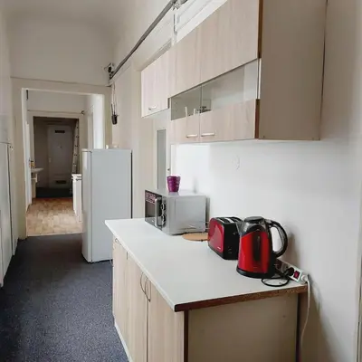 a kitchen with a counter with a microwave and a refrigerator at Just 3 min Walk Old Town Center private room E in Prague