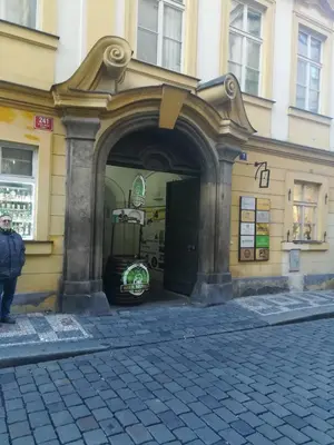 an entrance to a building with a man standing outside at 3 min Walk Old Town Center private room A in Prague