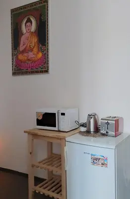 a microwave sitting on a table next to a refrigerator at 3 min Walk Old Town Center private room B in Prague