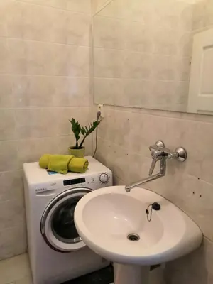 a bathroom with a washing machine and a sink at 3 min Walk Old Town Center private room B in Prague