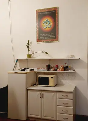 a microwave sitting on top of a counter with a shelf at Charles bridge, Old town3 Min walk Private Room A in Prague