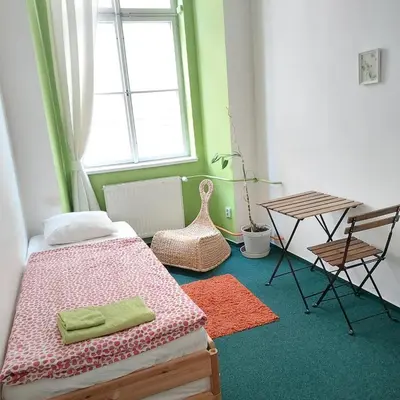 a bedroom with a bed and a table and a chair at Charles bridge, Old town3 Min walk Private Room B in Prague