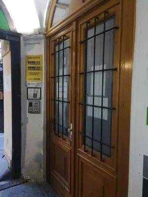 a pair of wooden doors in a building at Charles bridge, Old town3 Min walk Private Room G in Prague